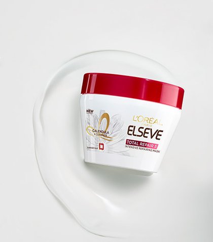 Foto del envase de la mascarilla Elvive Reparacion Total 5 en textura